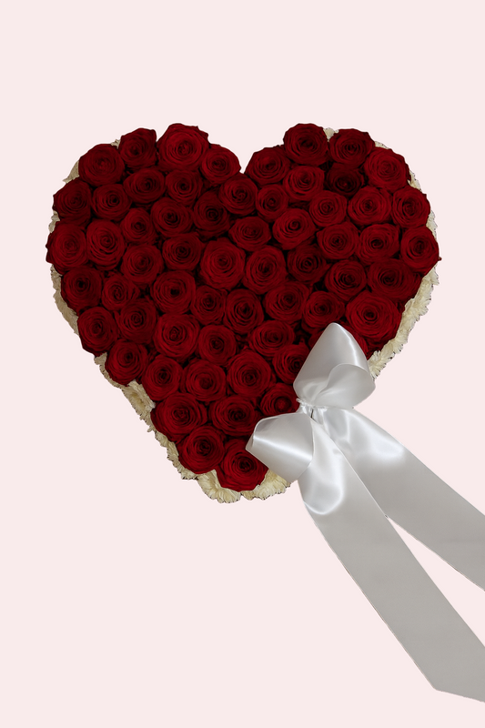 Heart-Shaped Funeral Arrangement with Red Roses and White Border